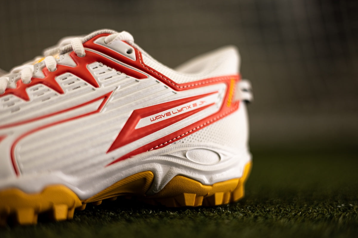 Mizuno Wave Lynx 2 Junior Hockey Shoes White/Fiery Coral/Citrus 25/26 | ONE Sports Warehouse