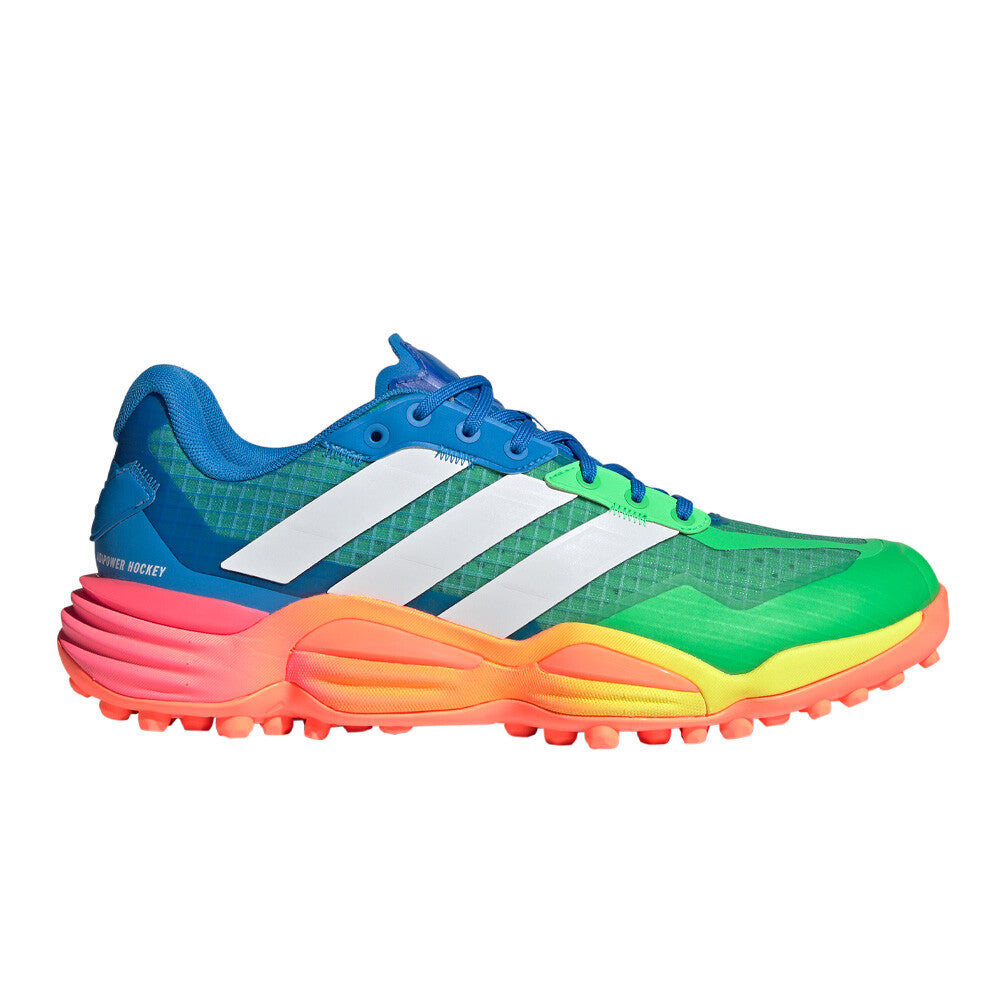 A vibrant Adidas Field Hockey shoe with a multicolor rainbow design, featuring blue, green, yellow, orange, and pink sections, white three-stripes, and a textured outsole, shown against a plain white background.