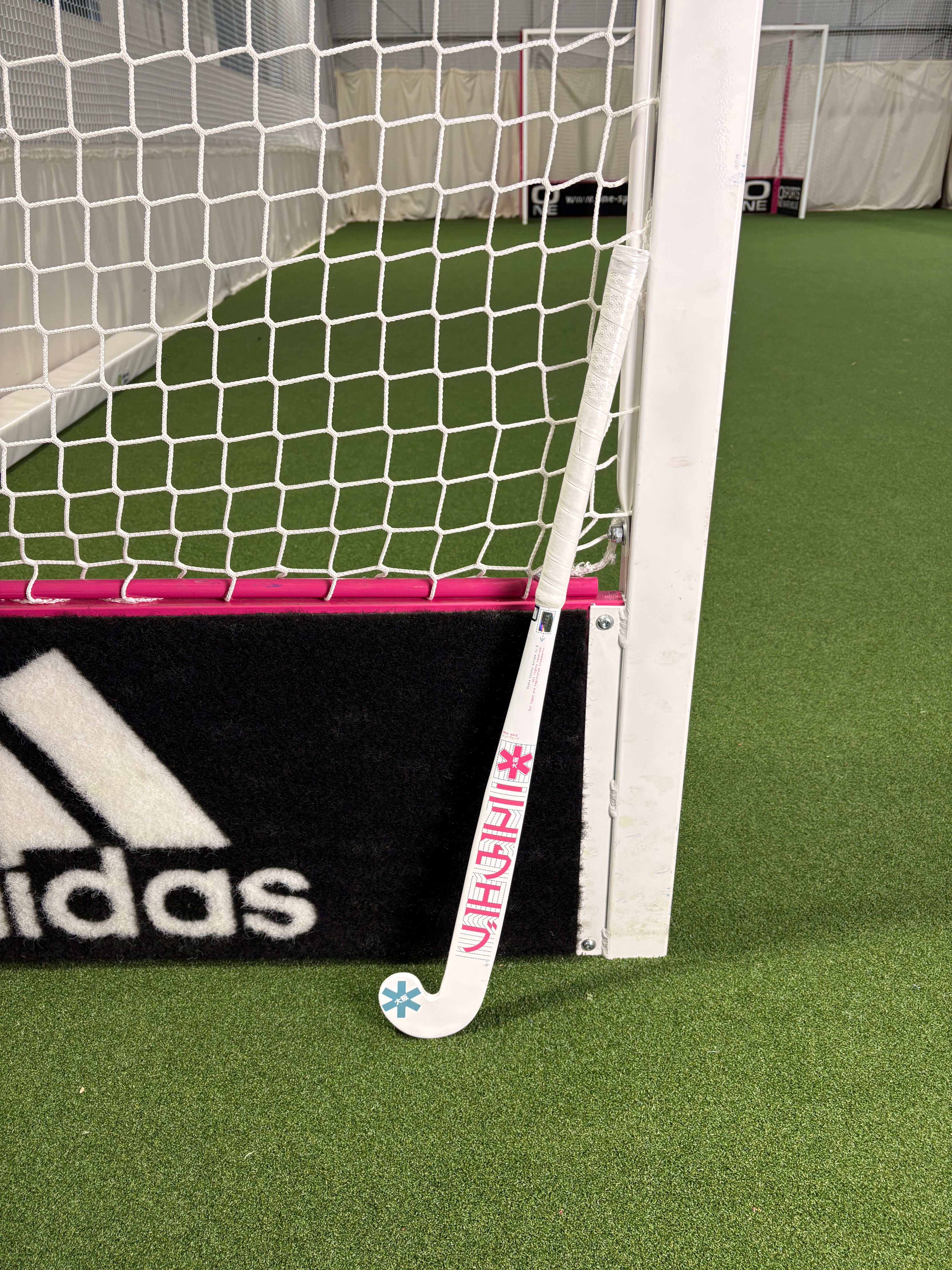 Osaka Mid Bow WG Raspberry Junior Hockey Stick Ex-Demo | ONE Sports Warehouse